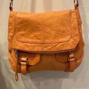 The Sak orange crossbody handbag
